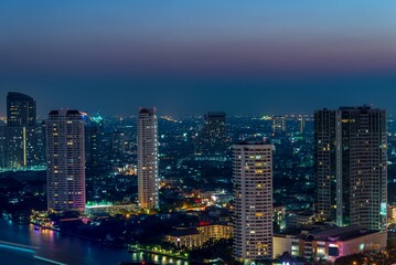 Obraz na płótnie Canvas Night cityscape of modern capital Bangkok city, Thailand. Building, architecture and city concept.