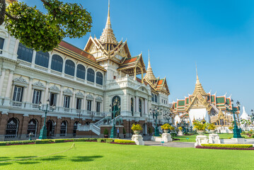Naklejka premium The Grand Palace, Wat Pra Kaew temple landmark in blue sky background, Bangkok Thailand. Travel in Asia concept.
