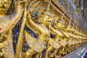Beautiful golden statue decoration in Royal Palace of Bangkok, wat pra kaew temple grand palace Thailand. Travel in Asia concept.