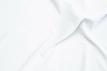 White fabric texture that is white cloth surface background with beautiful soft blur pattern.