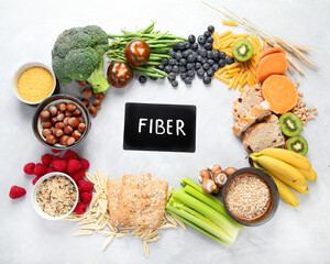Foods high in fiber on gray background.