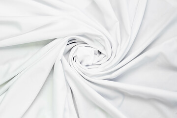 White fabric texture that is white cloth surface background with beautiful soft blur pattern.