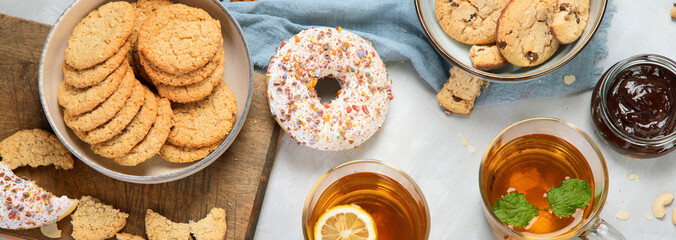 Delicious oat cookies on light background.