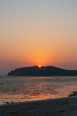 The sunset, the red sky and the tidal flat.