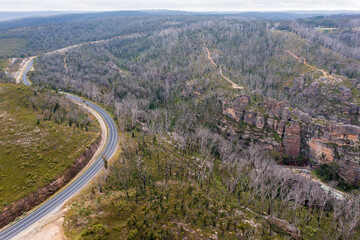 Fototapeta na wymiar Drone aerial photograph of a highway running through a forest in regional Australia.