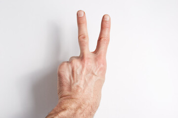 Hand on a white background two fingers index and middle point up