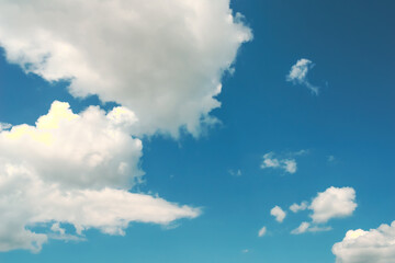 Obraz na płótnie Canvas Blue sky, white clouds with yellow spots