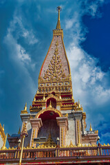 Traditional Thai temple ornamental facade decorations at temple in Phuket, Thailand.