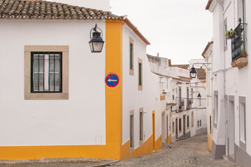 Street view with beautiful old residential buildings in the city of Evora in Portugal