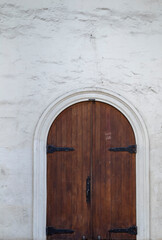 Arched, vintage wooden doors.
