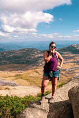 Naklejka premium girl at the top of the mountain