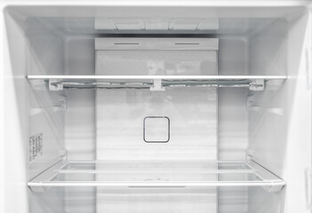 Inside of clean and empty refrigerator with shelves. background for health or diet concept. empty...