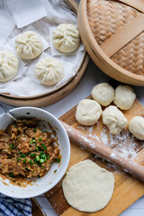 Homemade Chinese cuisine pastry. Vegetable Bao Making Before Steaming. Stir fry turnip strips with dried shrimps in oyster and soy sauce to taste.
