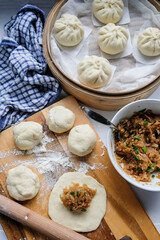 Homemade Chinese cuisine pastry. Vegetable Bao Making Before Steaming. Stir fry turnip strips with dried shrimps in oyster and soy sauce to taste.
