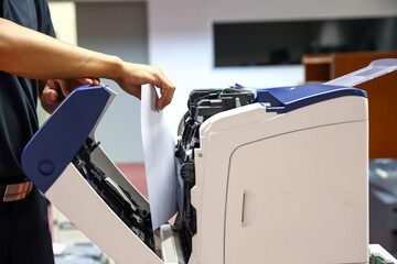 Technician hand open cover photocopier or photocopy to fix paper jam and replace ink cartridges for...