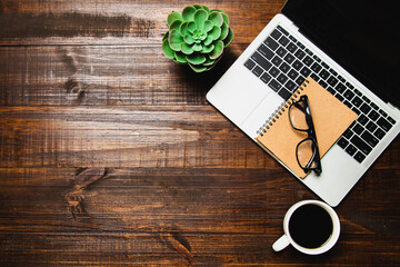 Top view desk flat lay background with computer laptop and office equipment for empty work area copy space concept.