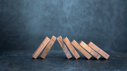Wooden block stack concept of prevent collapse or crash of financial business and risk management...