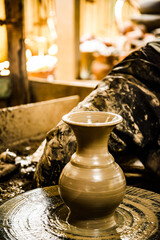 A potter makes pottery by hand at Koh Kret, Nonthaburi, Thailand.