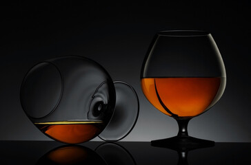 Elegant glasses of luxury whiskey on a dark background