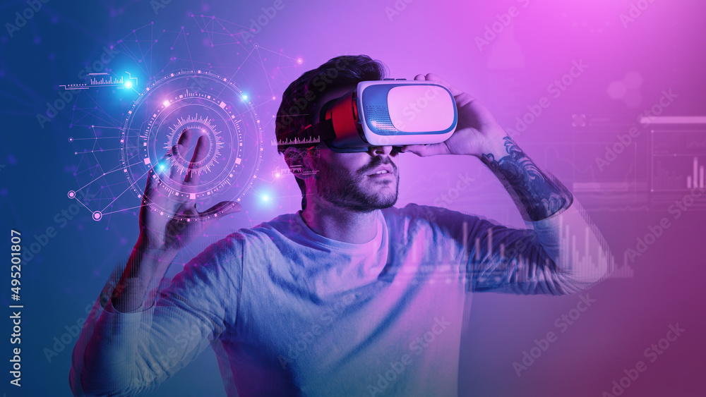 Poster modern man in vr glasses pressing button at virtual screen with futuristic graphs and charts, creati