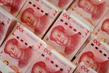Bundles of Renminbi. Chairman MAO zedong's portrait on the background of 100 Yuan, Chinese banknotes, RMB banknotes. Chinese or Asian economic growth, financial business, the concept of a US trade war