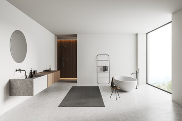 Light bathroom interior with sink, tub, douche and panoramic window