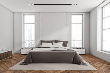 Fototapeta na wymiar Stylish bedroom interior with bed on carpet, panoramic window on city view