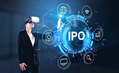 Businesswoman in suit is wearing vr helmet touching digital inte