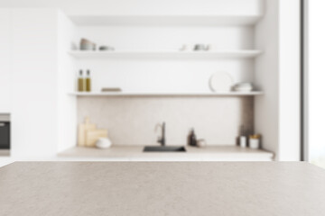 Fototapeta na wymiar Grey countertop on background of kitchen interior with window. Mockup