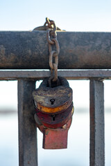 Wedding iron locks on chains attached to the bridge