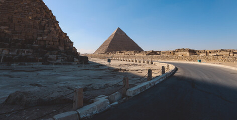 Fototapeta na wymiar Natural View to the Great Pyramid of Giza under Blue Sky and Day Light - is the oldest and largest of the pyramids in the Giza pyramid complex, Egypt