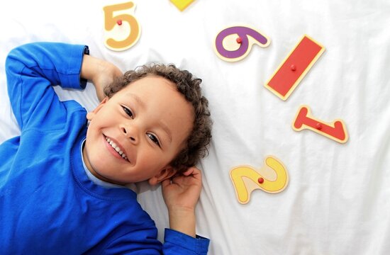 preschool learning numbers playing with various toy numbers and shapes at  playschool stock image and stock photo