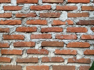 Close up shoots of red soil wall bricks in the backyard taken during the day