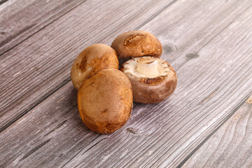 Raw brown champignons mushroom heap