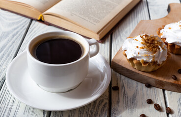 Delicious morning breakfast. Coffee with mint cakes on the background of an old white wooden countertop.