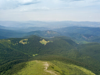 High mountains of the Ukrainian Carpathians in cloudy weather. Aerial drone view.