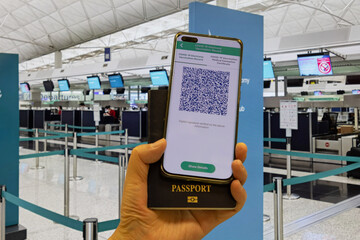 Vaccine pass in mobile phone app and passport required to take airplane, train, high speed rail and...