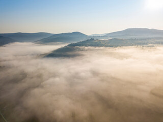 Morning fog in the Ukrainian Carpathians. Aerial drone view.