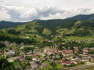 Fototapeta na wymiar Settlement in the mountains of the Ukrainian Carpathians. Aerial drone view.