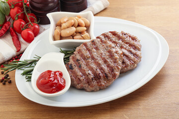 Grilled beef burger cutlet with sauce