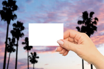 Hot summer horizontal business card mock up. Travel and vacation themes. Woman hand on Malibu...