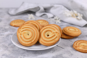 Ring shaped spritz biscuits, a type of German butter cookies made by extruding dough with a press fitted with patterned holes