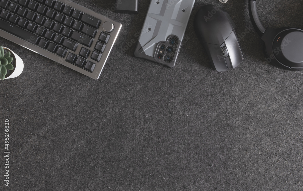 Poster top view of home desk table with keyboard, mouse and accessory on table.