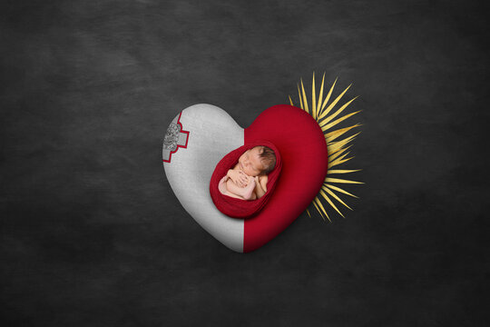 Newborn portrait on heart in color of national flag. Photography peace concept. Malta