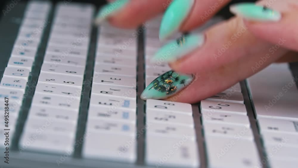 Poster business woman's fingers are typing on the keyboard of a white laptop. the hands of a young girl are