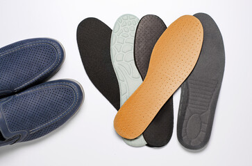 Different insoles for shoes. White background. Close up