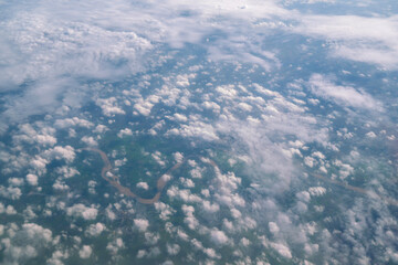 Blue sky and Clouds as seen through window of aircraft