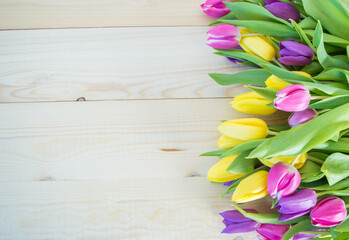 tulips on wooden ground with space for text
