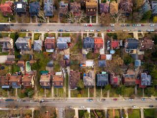 Top view of two parallel streets with single family houses and cars parked on the street at East...