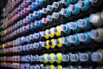 graffiti spray. a huge assortment of colors for street art on the shelves in the store